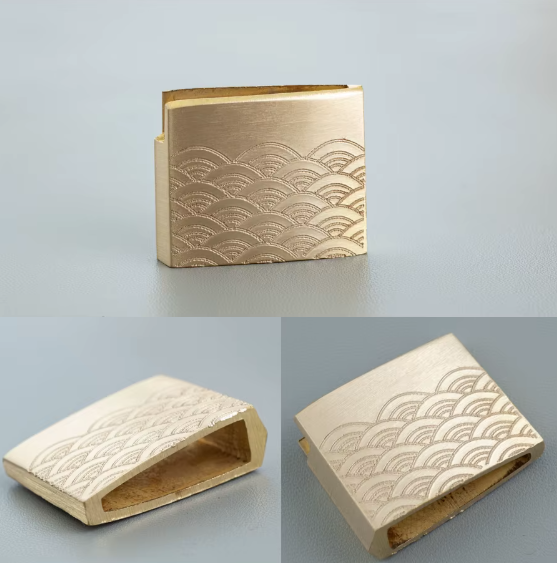Tradycyjne habaki mosiężne z grawerowanym japońskim motywem fal Seigaiha.